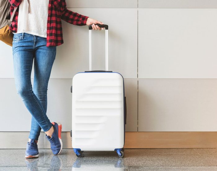 woman-luggage-airport-shutterstock_683275162